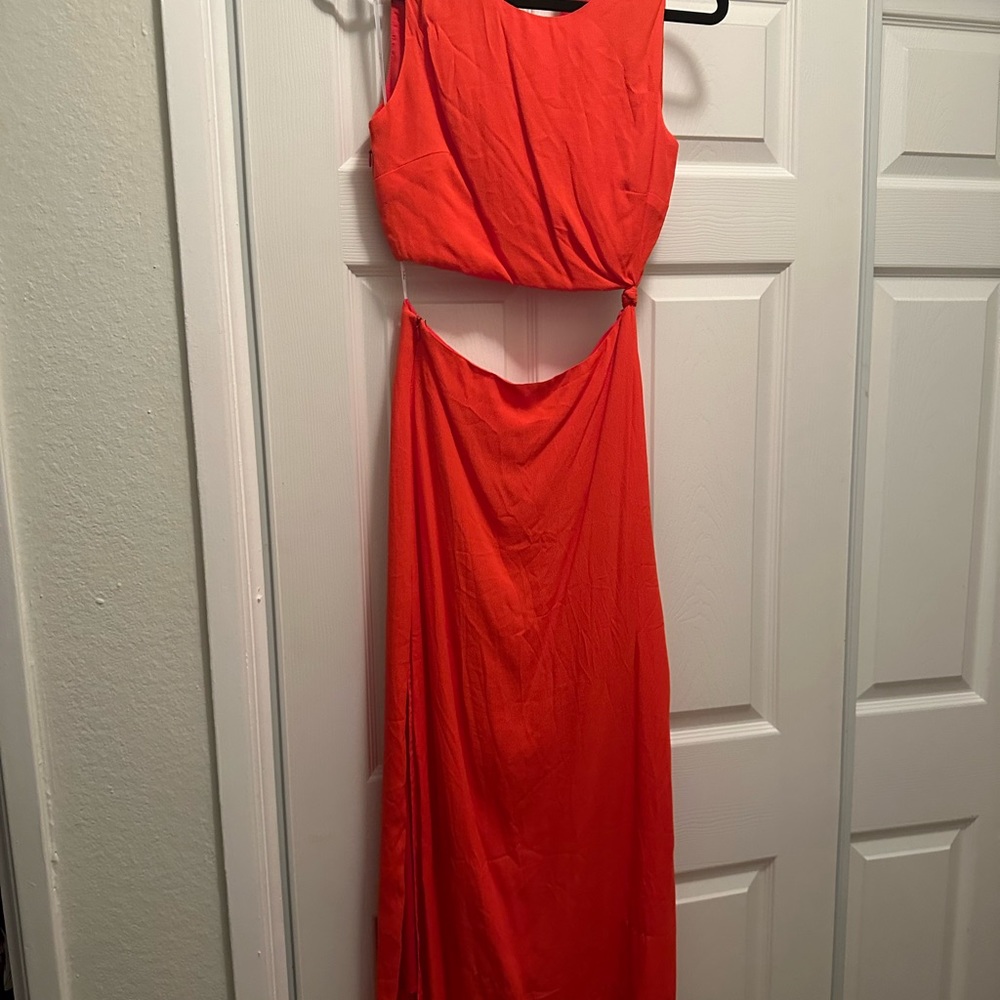 Lulu’s red (more reddish orange), sexy cutout dress. Sexy but classy.